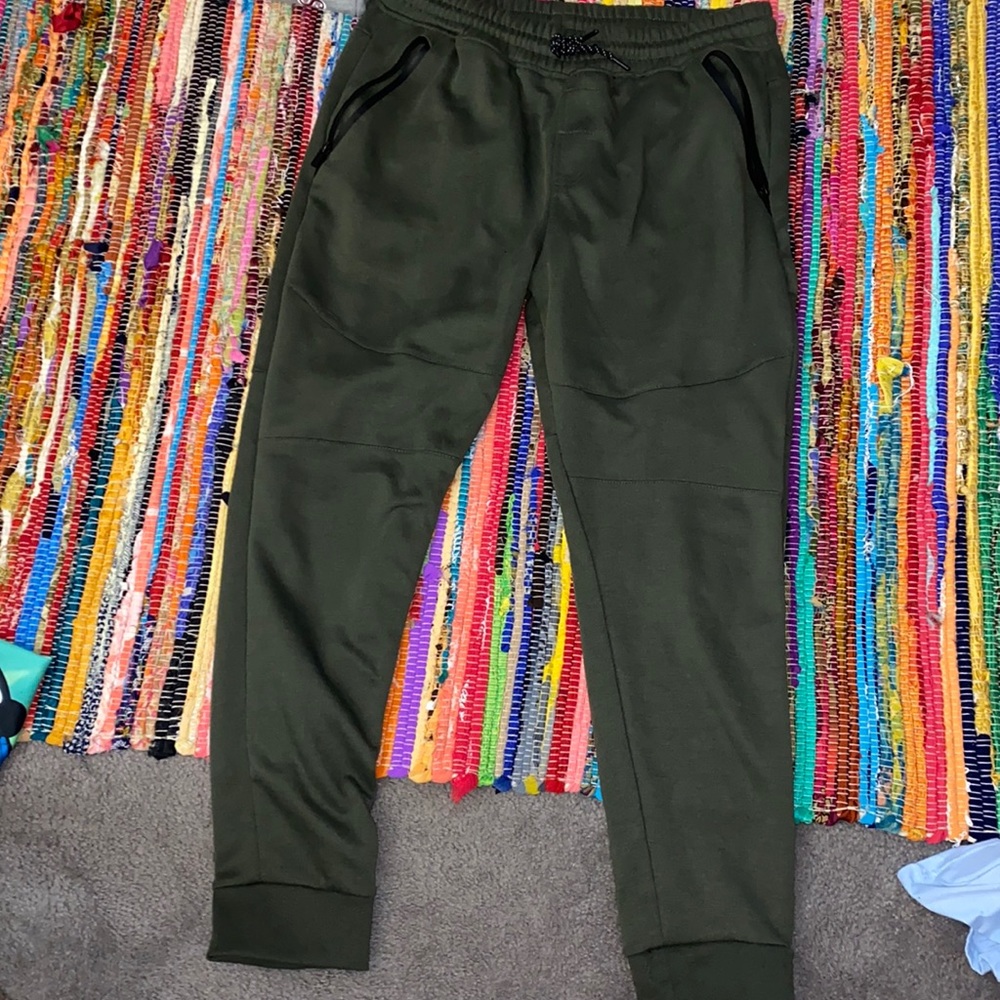 Green joggers with pants zippers